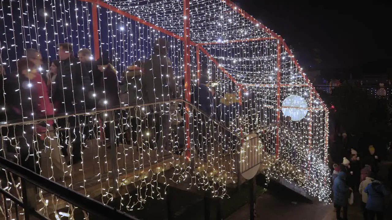 Crowd Of Tourists Using Stairs Decorated With Fairy Lights At Night