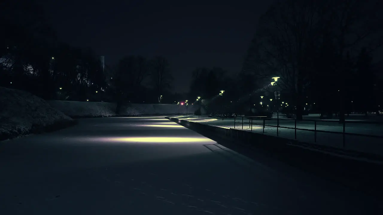 Frozen pond covered with snow in a city park in Tallinn Estonia