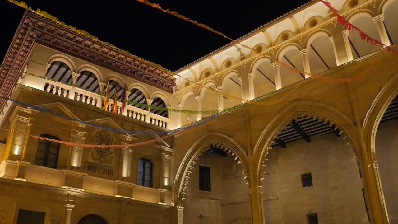 Exterior Of Town Hall In Alcañiz Spain At Night panning shot