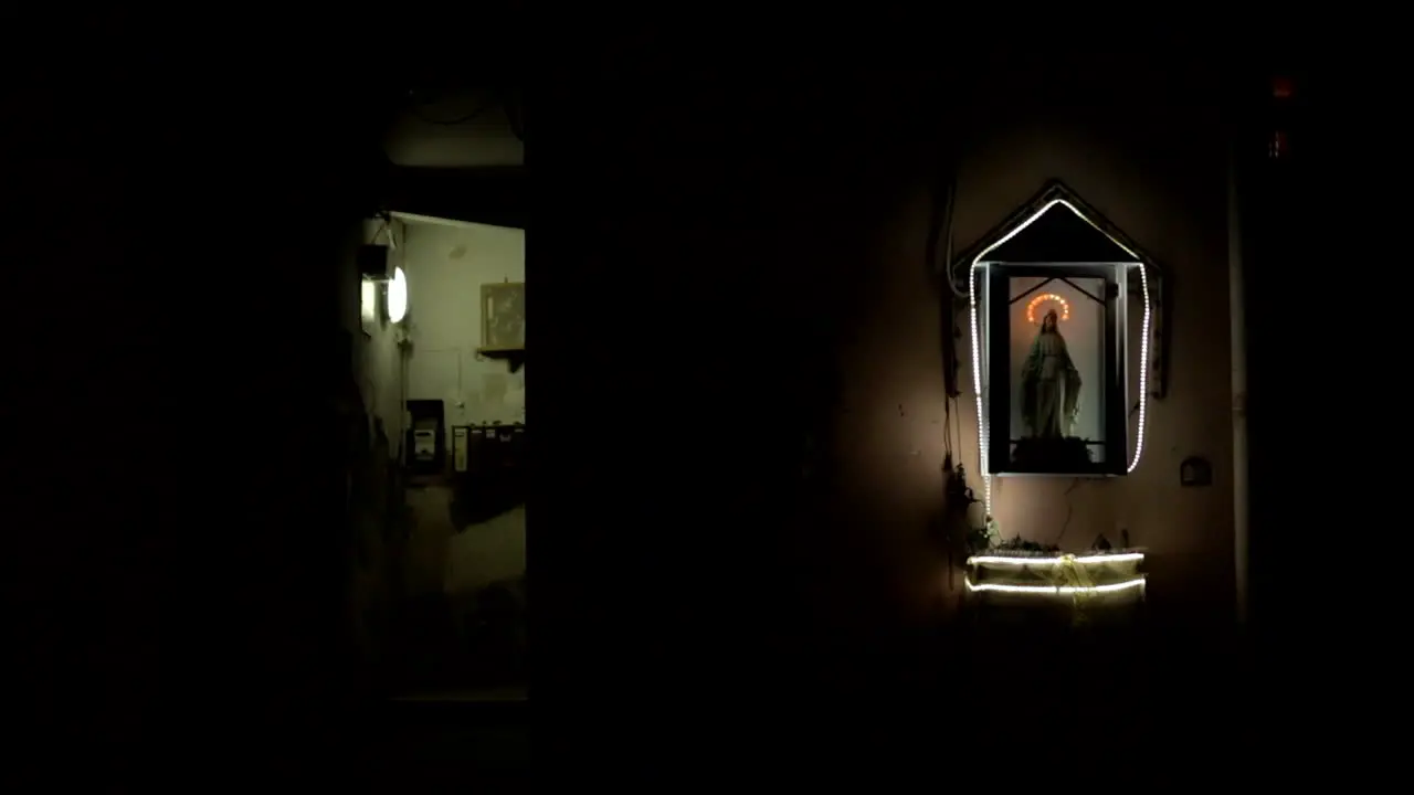 Locked Off View Of Jesus Statue At Night Outside Building In Castellammare di Stabia Italy