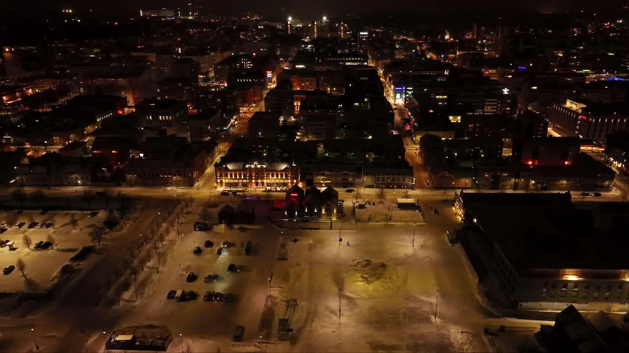 Aerial view overlooking the night lit market square of Oulu winter in Finland