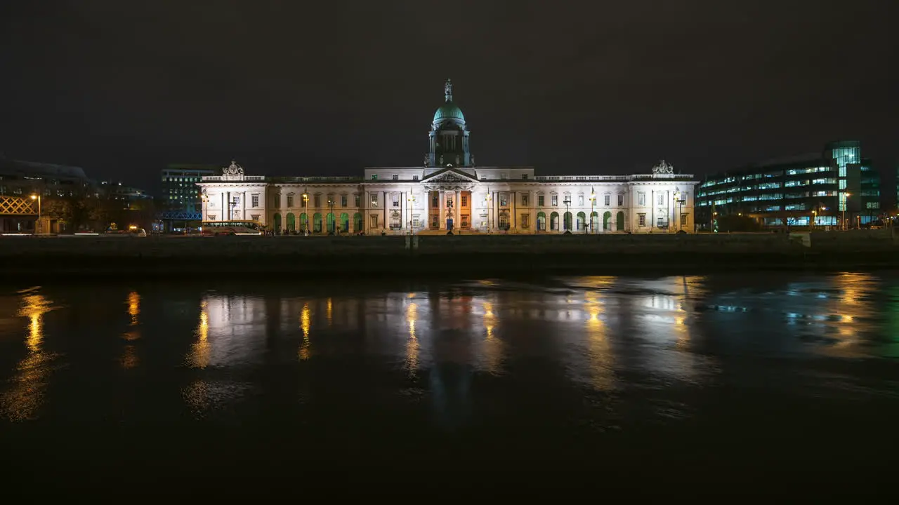 Time lapse of Custom House historical building in Dublin City at night with reflection on Liffey river in Ireland