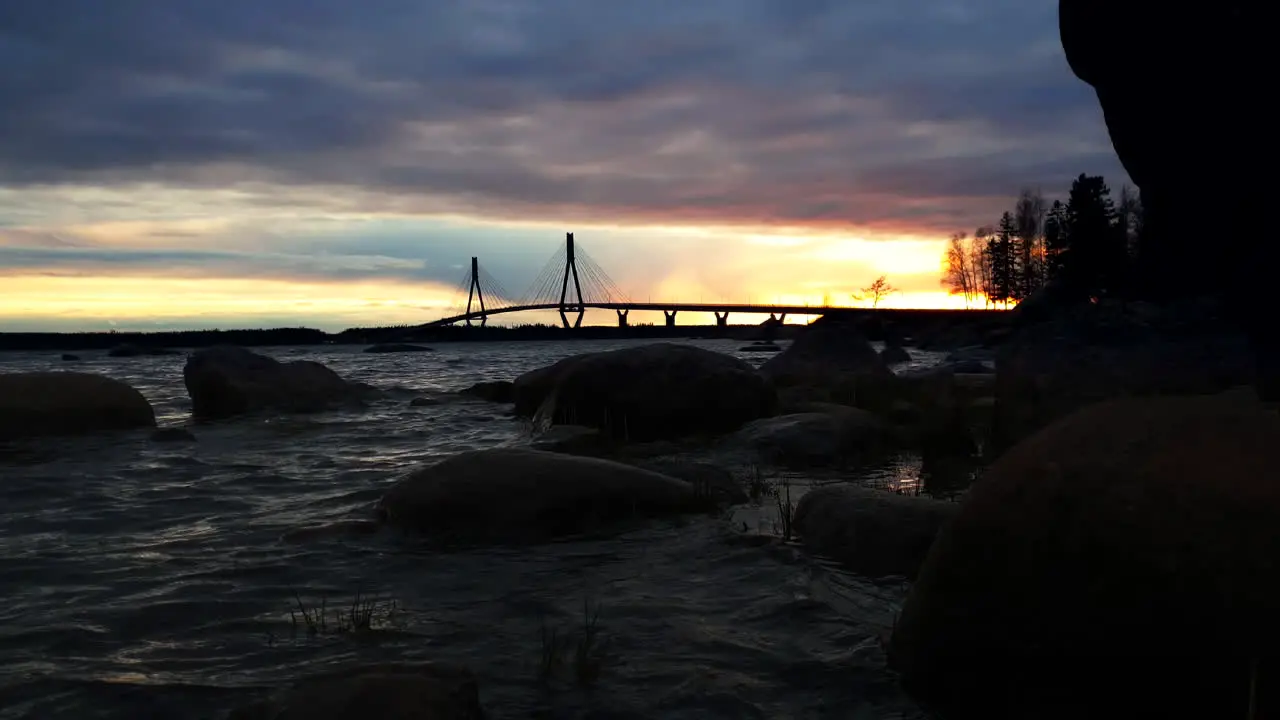 Spectacular sky colors during sunset with bridge in background