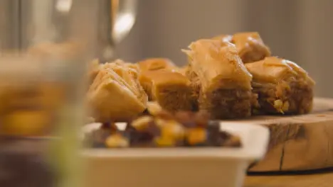 Close Up Of Baklava On Muslim Family Table In Home Set For Meal Celebrating Eid