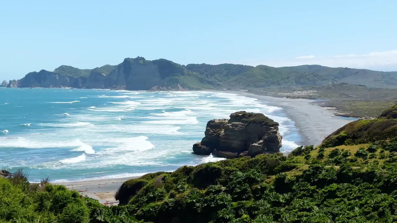 Waves and a beach at the Tepuhueico Park Coast Zone sunny day in Chiloé Chile