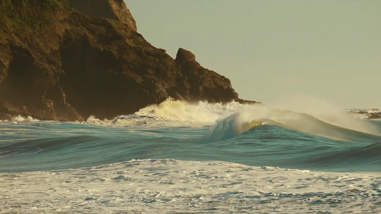 Ocean Waves Raging Over The Rocky Shore On A Windy Sunny Morning