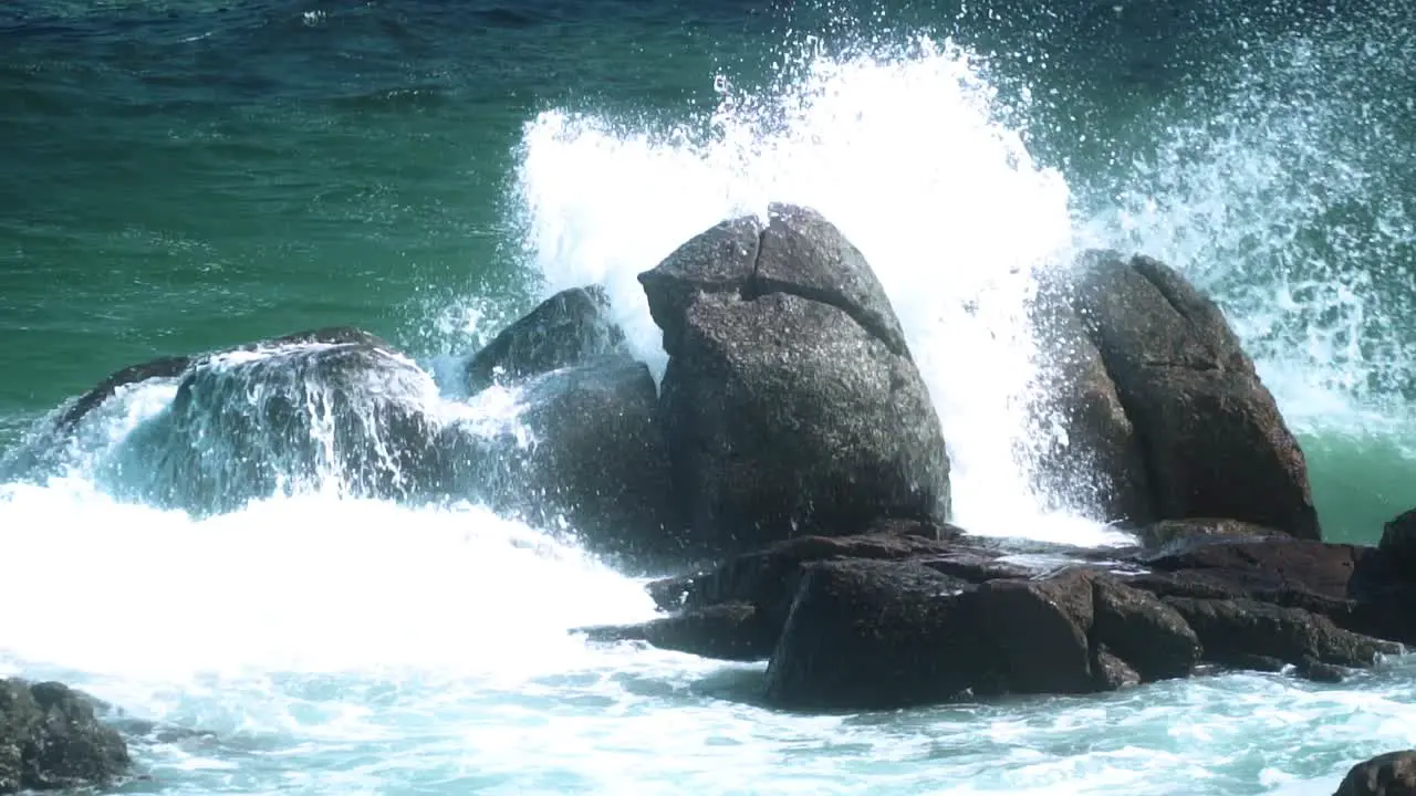 Ocean Waves Breaking On Rocky Outcrops Near The Coast In Summer