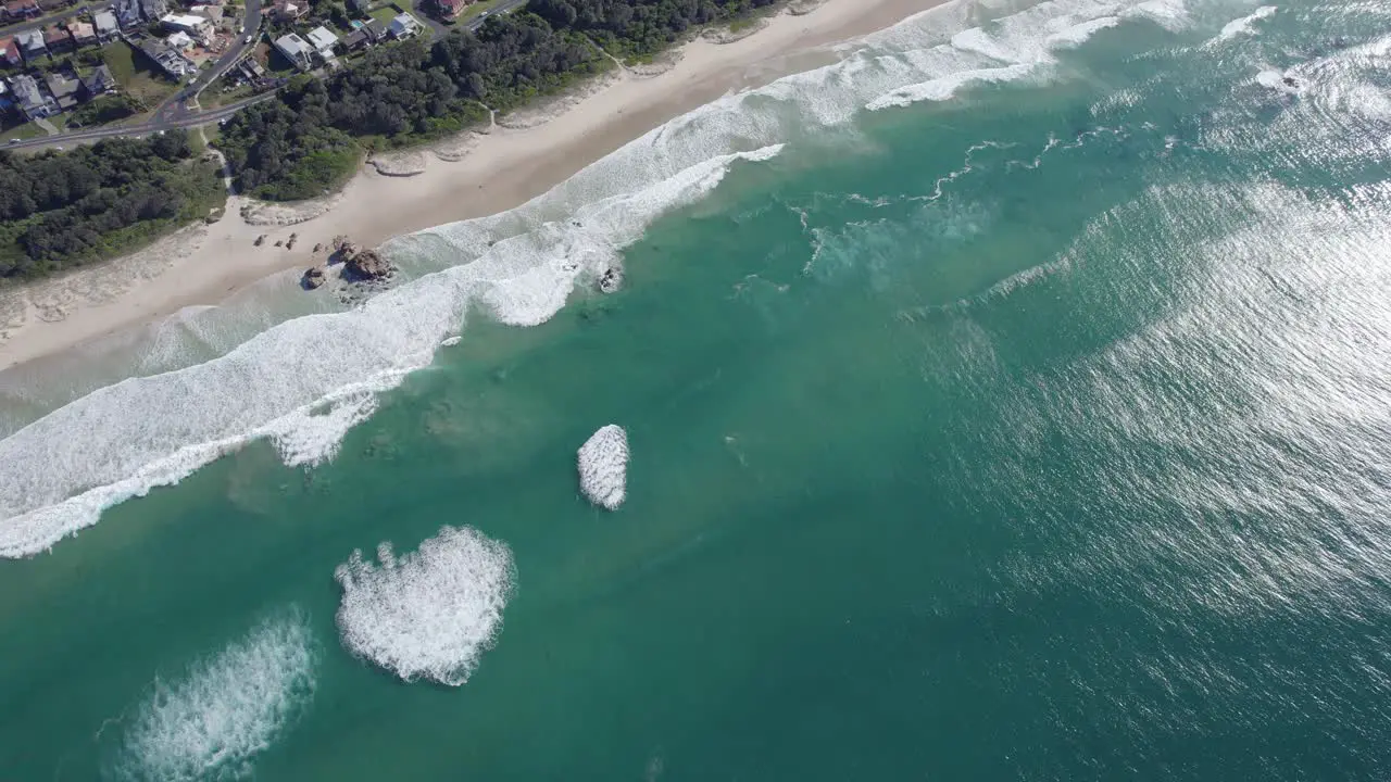 Foamy Waves Splashing On Sandy Shore Of Lighthouse Beach In Port Macquarie NSW Australia drone shot