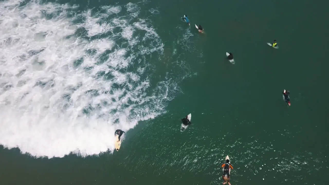 Pro Surfer catching a long wave in Peru South America Drone Aerial view