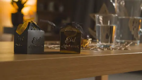 Close Up Of Gift Boxes On Table In Muslim Home Celebrating Eid 4