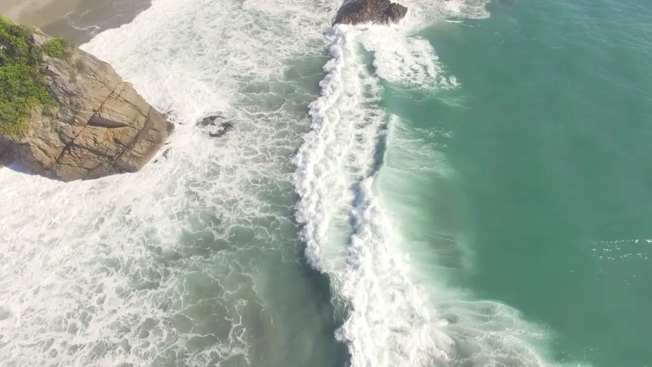 Sea Waves Crashing On The Rocky Shore In New Zealand Aerial Shot