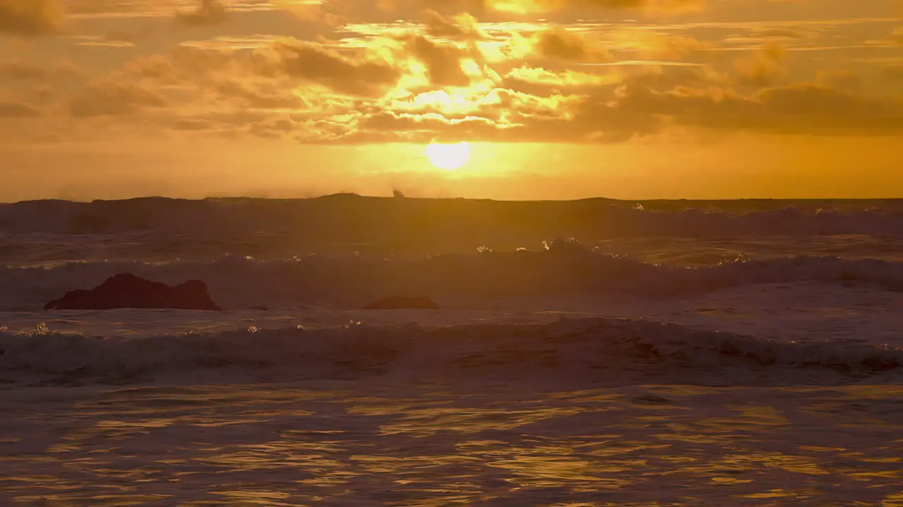 Crashing Sea Waves On Sunset Beach During Windy Day