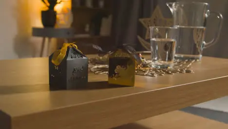 Close Up Of Gift Boxes On Table In Muslim Home Celebrating Eid 3