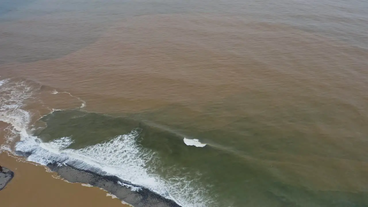 Aerial sea estuary freshwater mixing with ocean saltwater river mouth