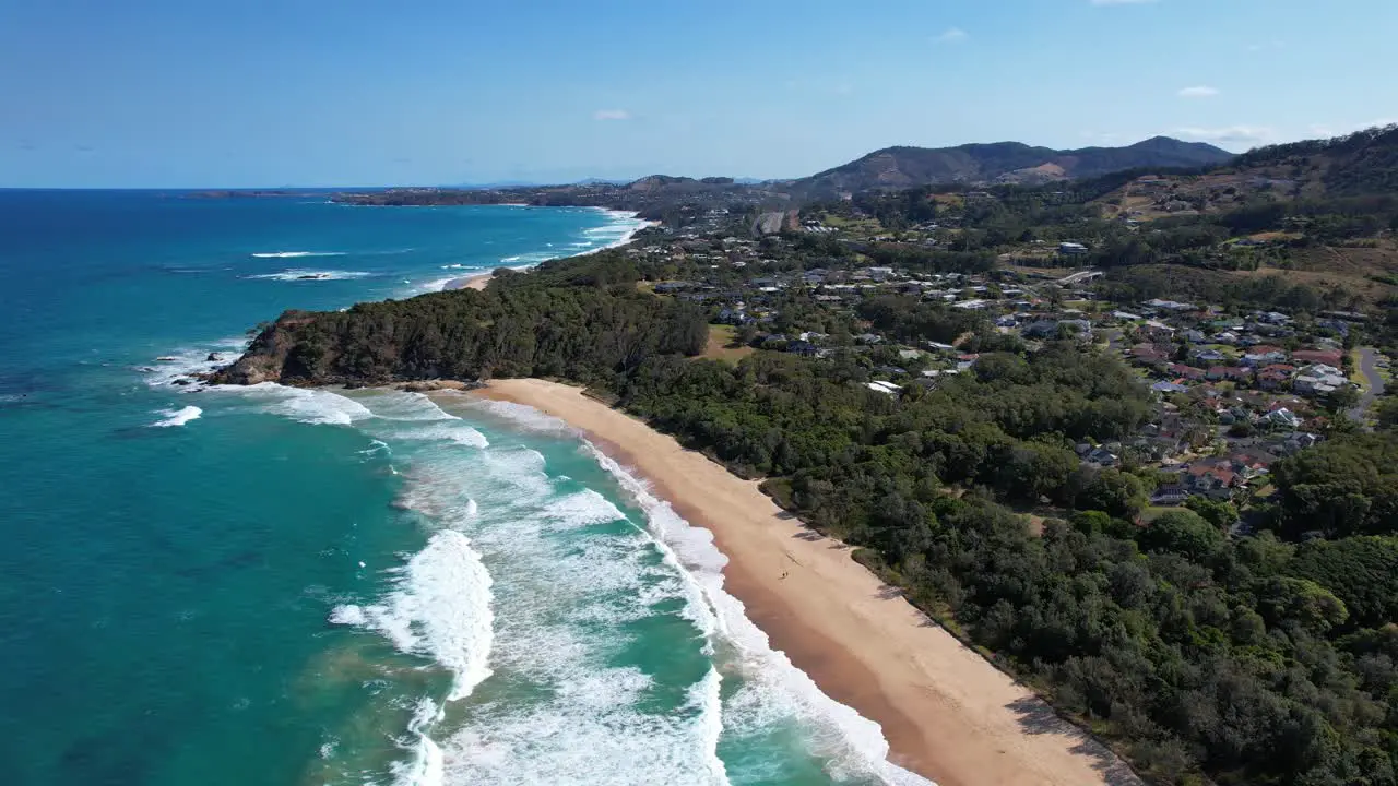 Ocean Waves Crashing On Sandy Shore Of Sapphire Beach In NSW Australia aerial shot