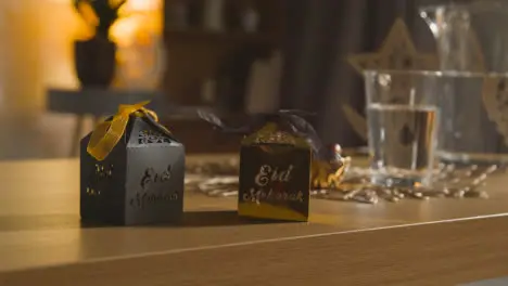 Close Up Of Gift Boxes On Table In Muslim Home Celebrating Eid