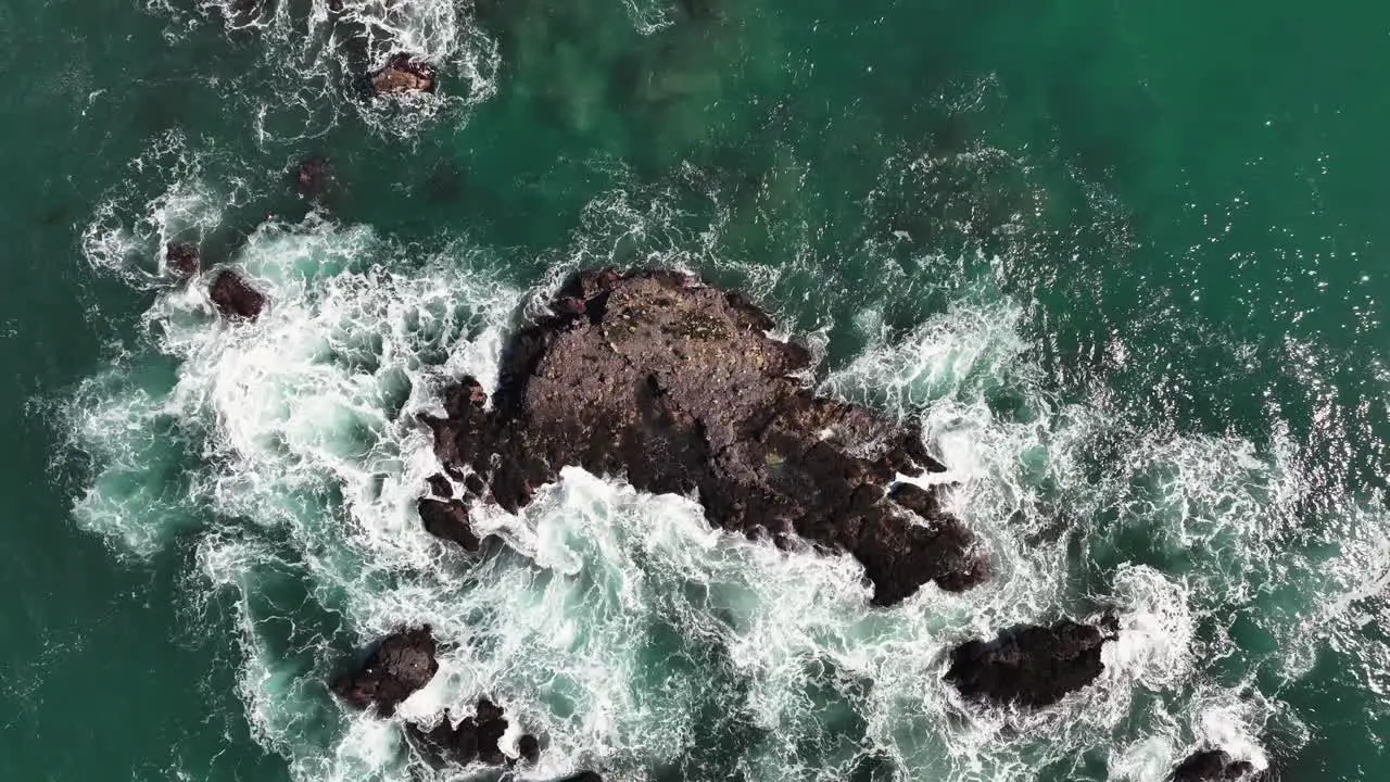 Top View Of Foamy Waves Splashing On Rocks In The Beach In Dana Point California United States Drone Shot