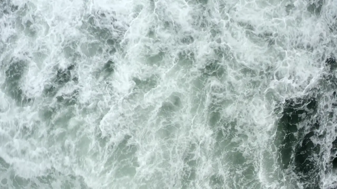 Top View Of Foamy Sea Waves At Tofino Beach In British Columbia Canada