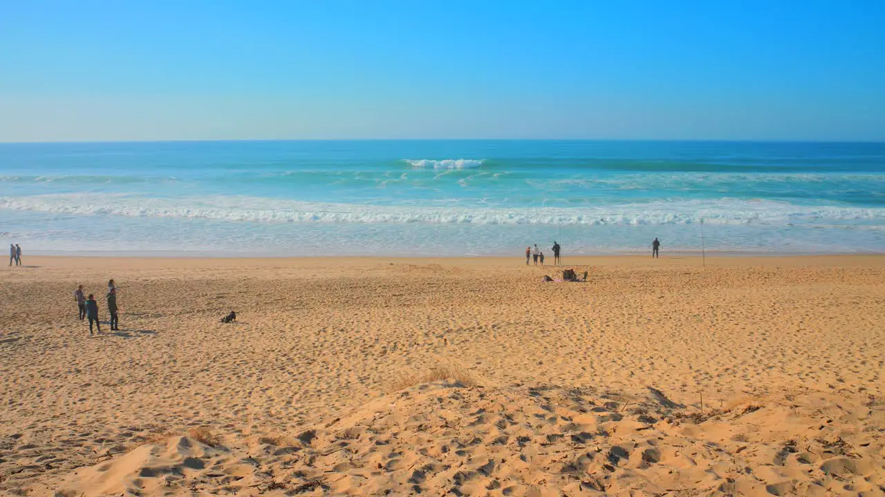 Astounding Scenic View Of Tourists Relaxing At The Beachfront Of Biscarrosse On A Sunny Day In New Aquitaine France