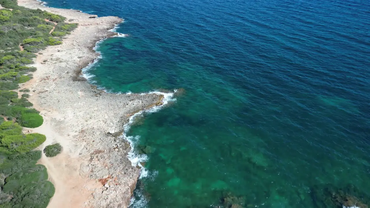 Serene View Of A Sea And Waves Gently Crashing On Rockshore Near Sa Coma Mallorca Spain