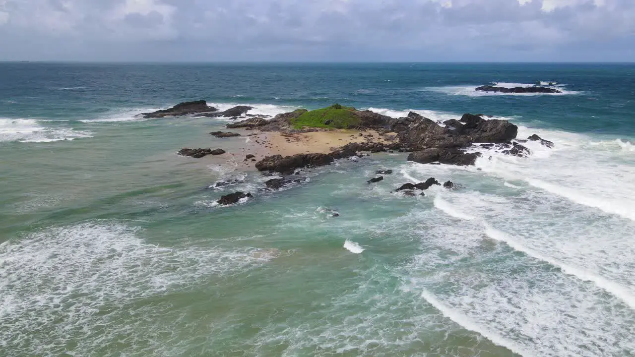 Blue Seascape With Surfing Waves Splashing On Rocks At Summertime In Sawtell Beach New South Wales Australia