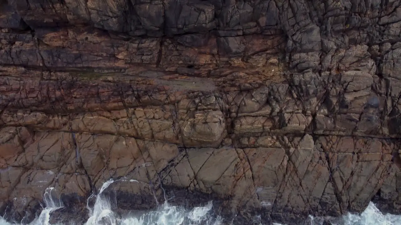 Rugged Cliffs And Ocean Waves In Arteixo Spain aerial top down