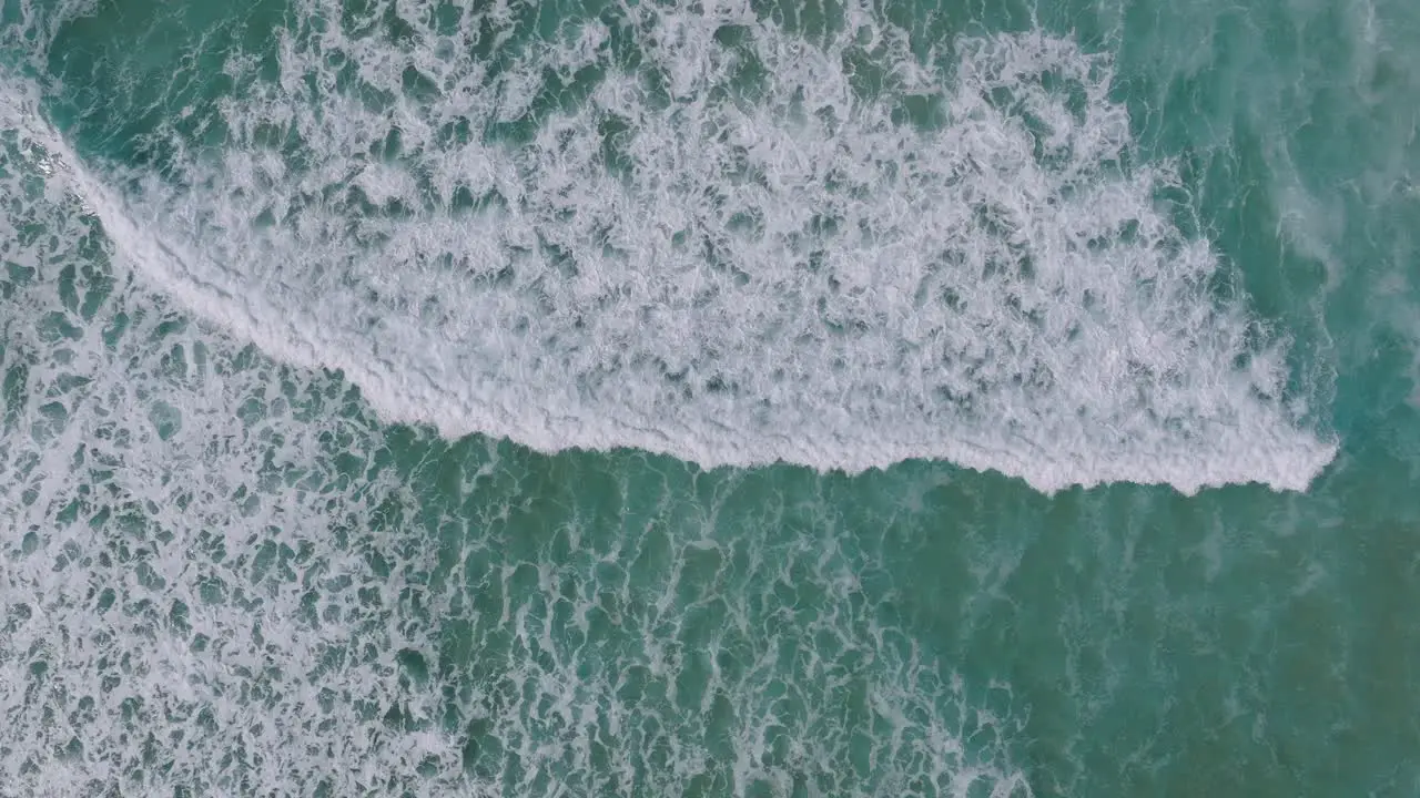 Topdown View Of Rolling Foamy Waves On The Tropical Beach Of Razo In Carballo Spain