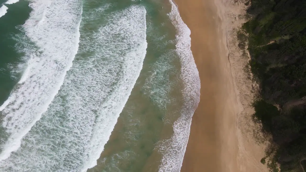 Scenery Of Foamy Waves Moving Towards Sandy Seashore Of Sawtell Beach During Summertime In New South Wales Australia