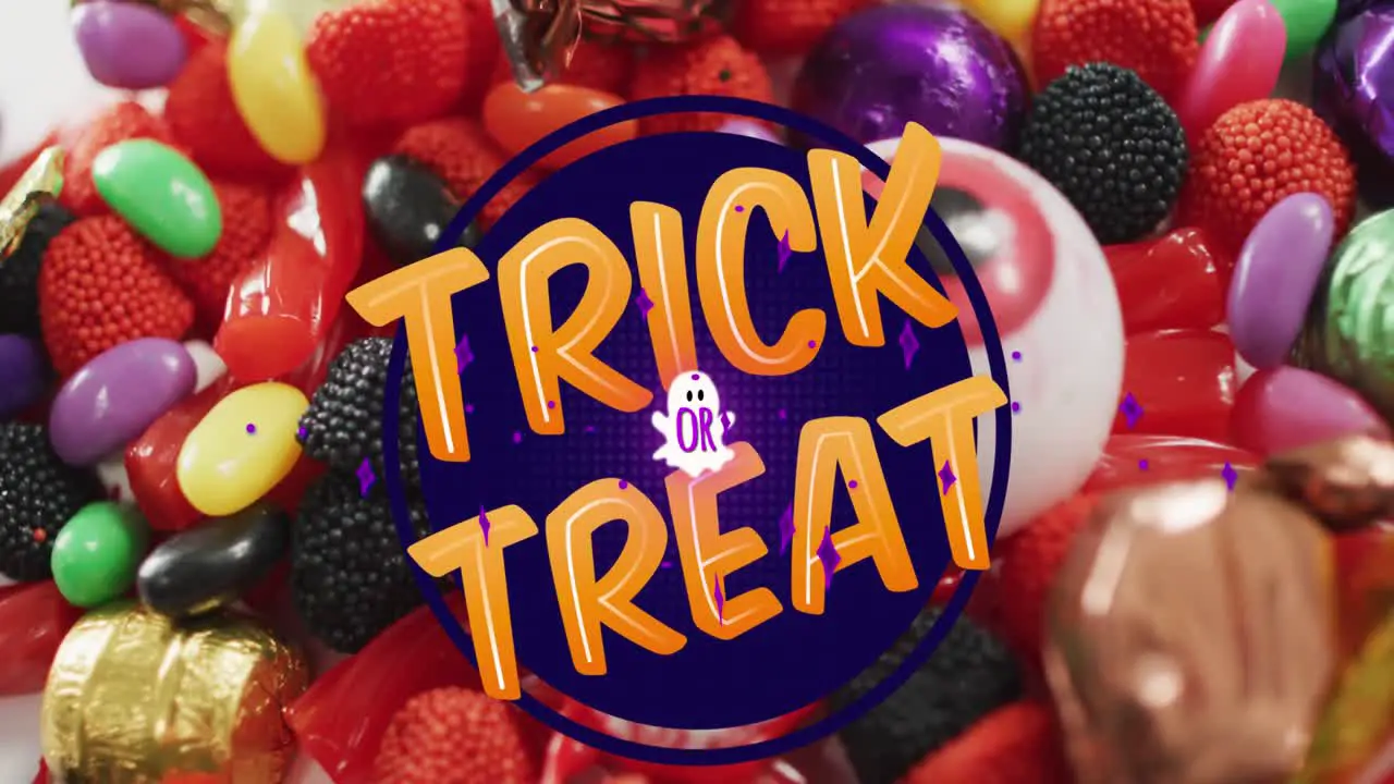 Animation of halloween trick or treat text over sweets background