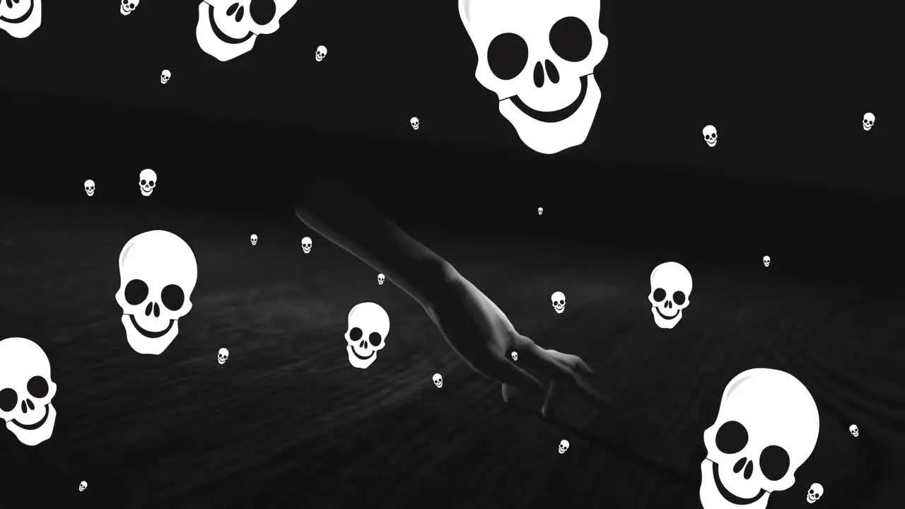 Animation of skulls falling over hand walking in black space