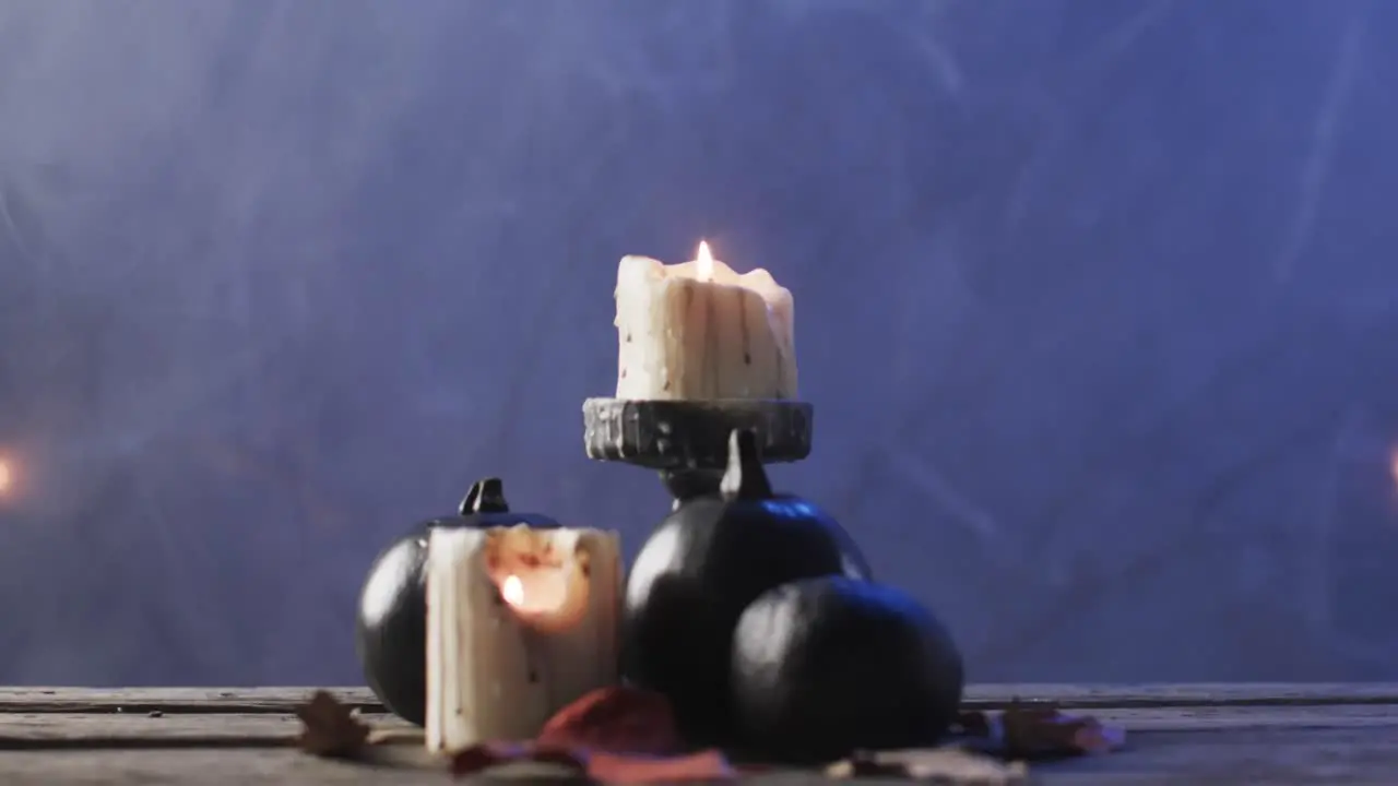 Video of carved pumpkins candles and smoke with copy space on purple background