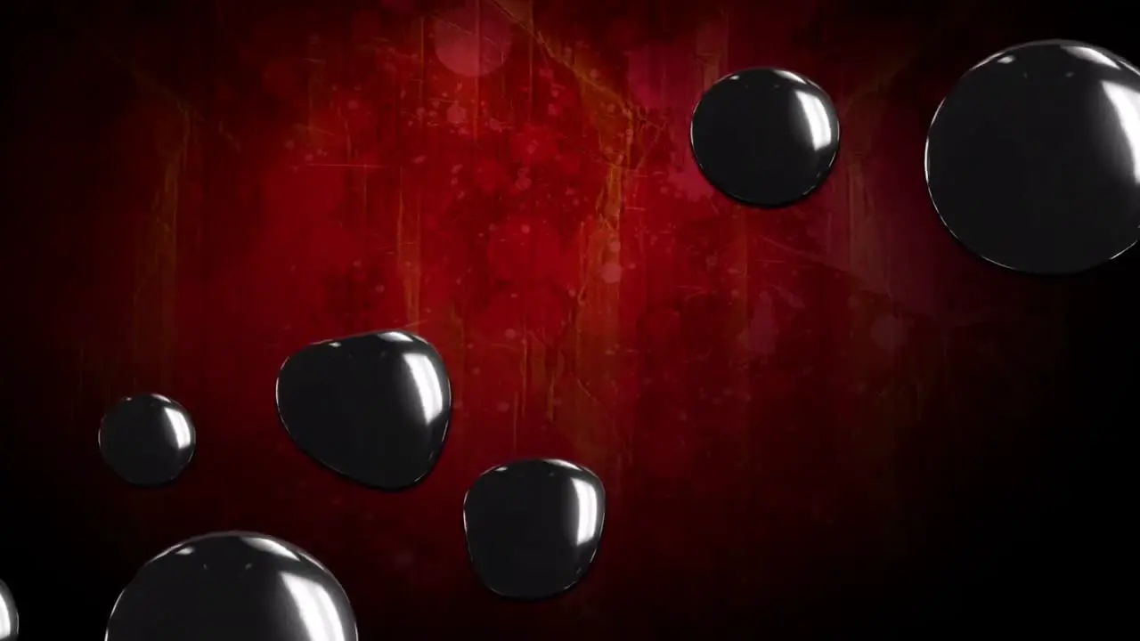 Animation of halloween black spots over red background