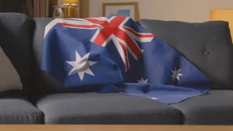 Flag Of Australia Draped Over Sofa At Home Ready For Match On TV