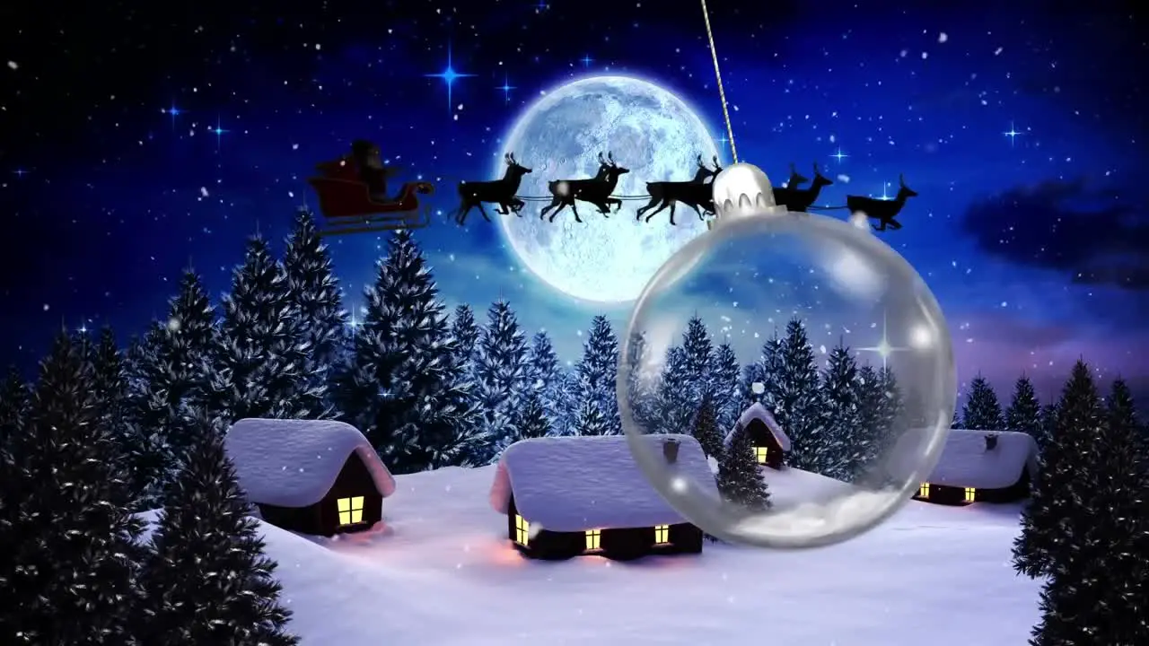 Animation of christmas bauble dangling over snow falling and full moon in winter scenery