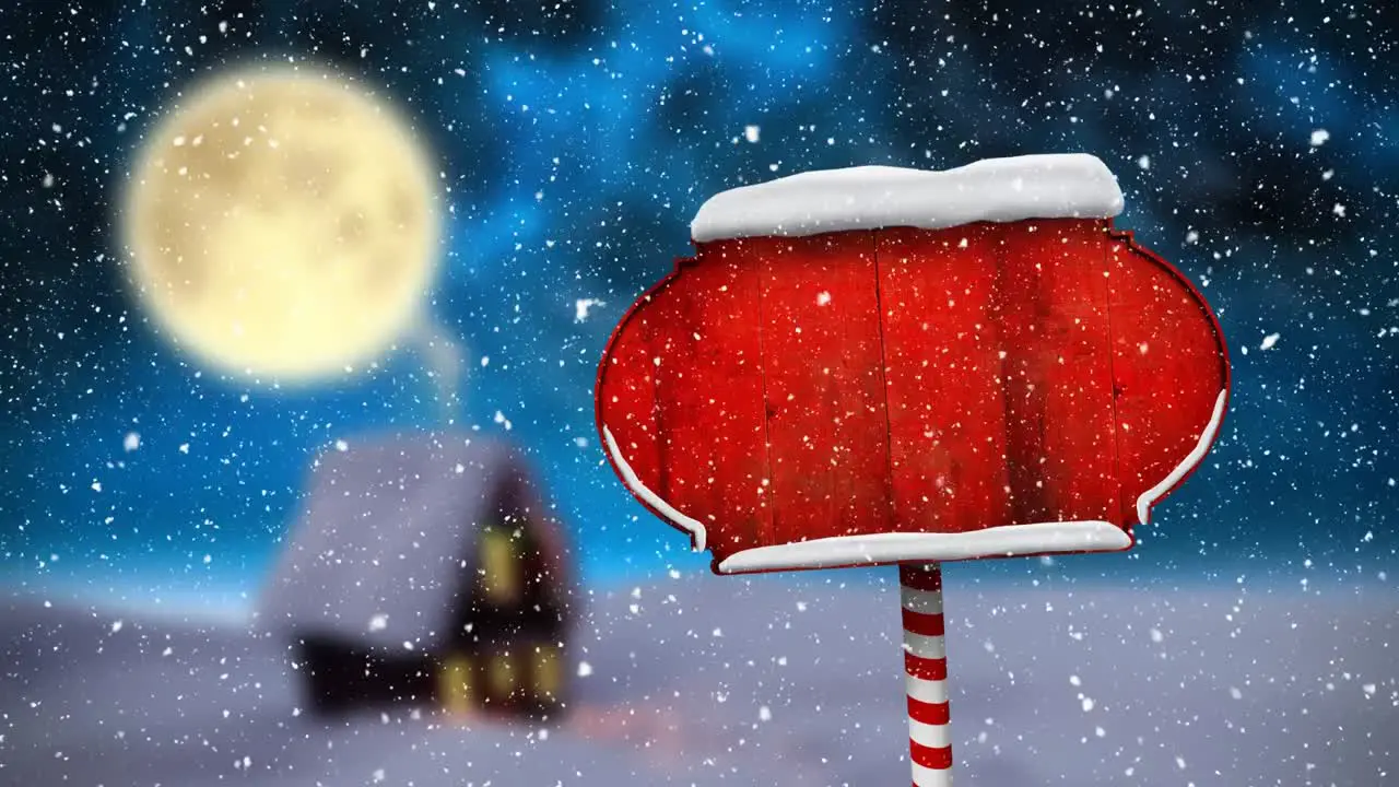 Digital animation of snow falling over red wooden sign post on winter landscape against moon in nigh