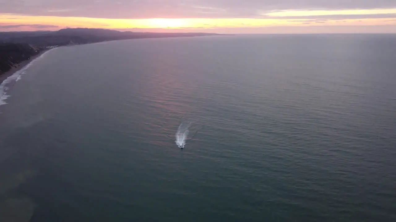 Boat cruising at sunset in Same beach Ecuador