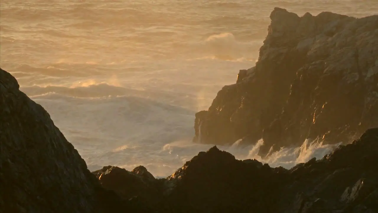 Winter waves and surf pound the rocks of the Big Sur Coast of California