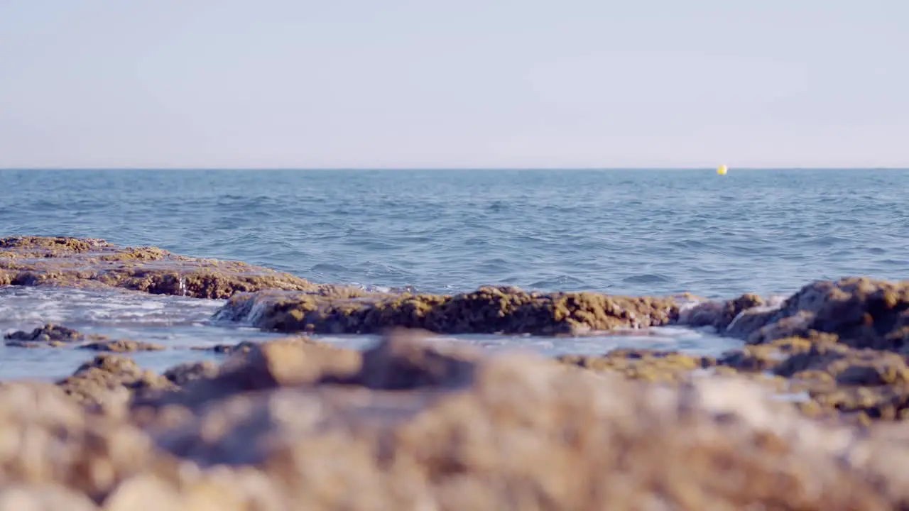 Mediterranean sea rocky shoreline in slow motion