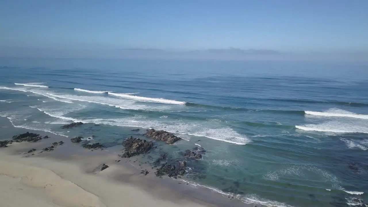 some surfers enjoying the perfect waves on the beach at Praia da arda afife Viana do Castelo