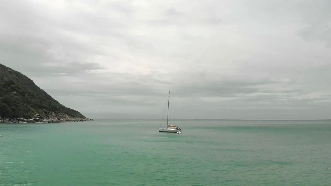 A wide shot of a boat in the bay of Ko Pha-ngan District Surat Thani Thailand Asia