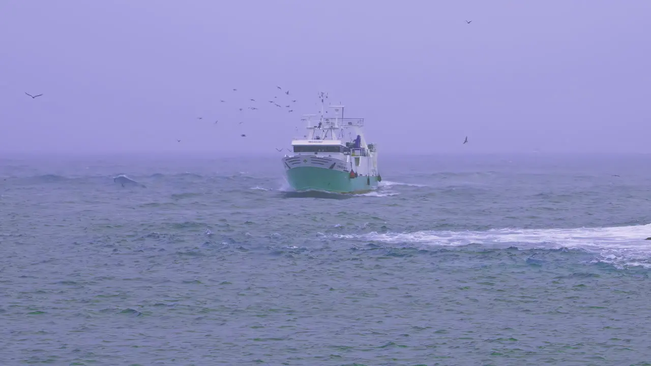 Ship crossing the stormy weather in slow motion