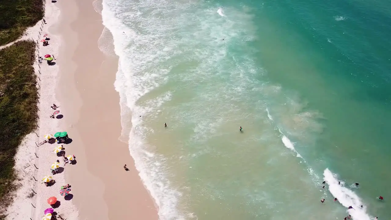 Drone shoot of tourists bathing on a brazilian beach