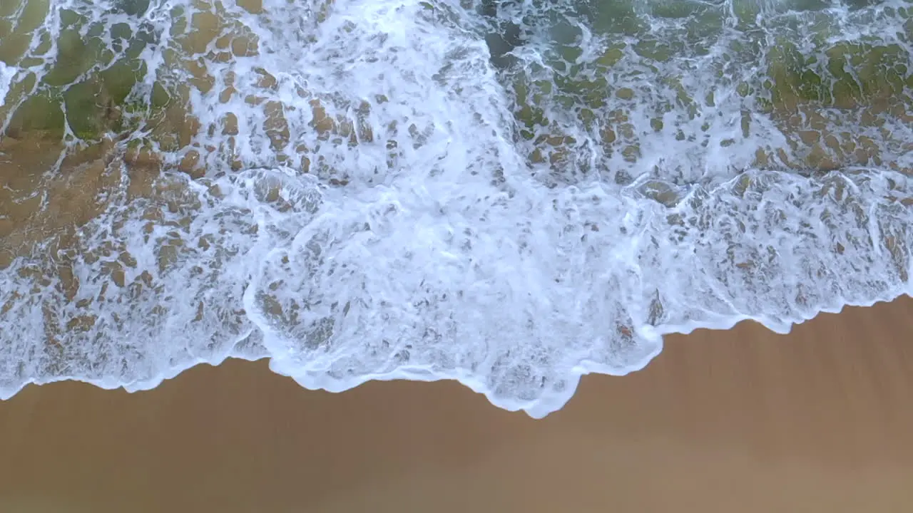 Waves crashing up onto a beach in slow motion 1080p