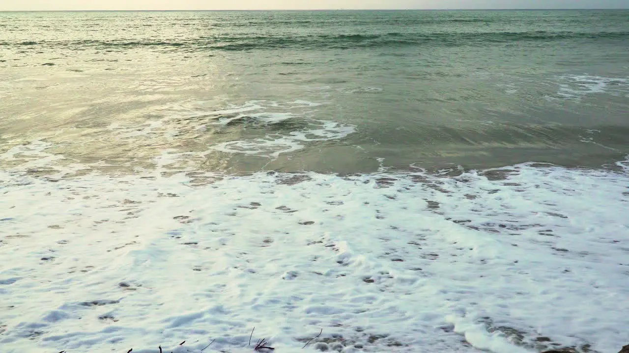 The foam is produced by the tides of the sea washing up the shore of Zorritos Beach in Tumbes Peru