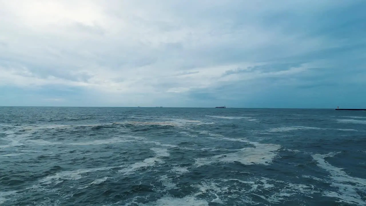 Ocean waves breaking on coast birds flying over open sea porto portugal city