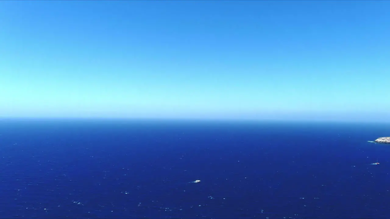 Aerial 4K Blue Sea and Sky Top View Over Akrotiri Santorini Greece Horizon Push In