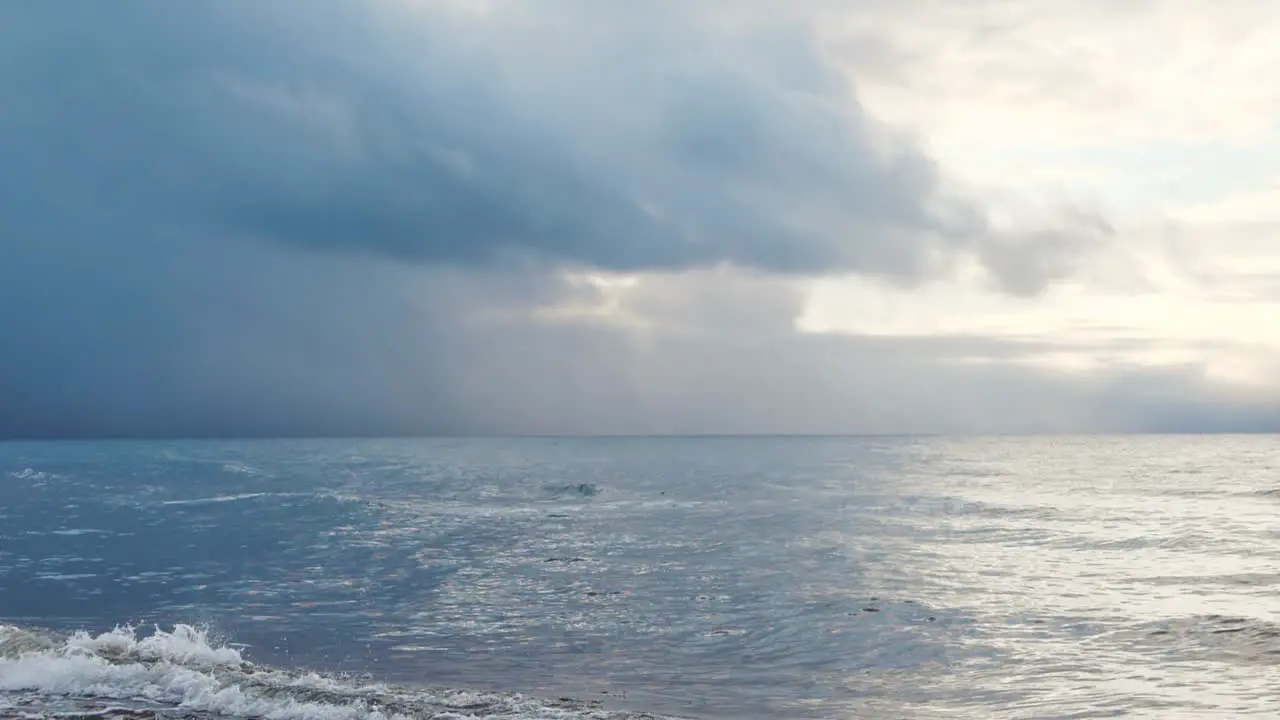 The small waves of the sea fight with the sand