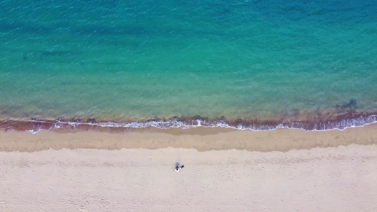 Top view of beautiful beach with one person on it