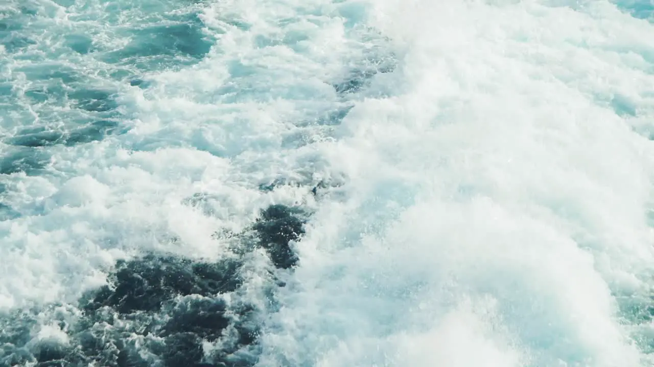 Slowmotion shot of wild backwash of a big ferry boat or cruise ship