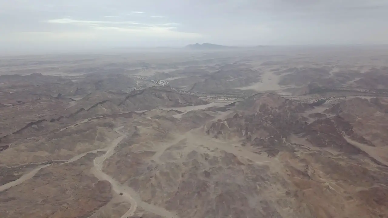 Aerial panning shot of Goanikontes mountains